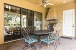 Lanai with summer kitchen and outdoor dining area